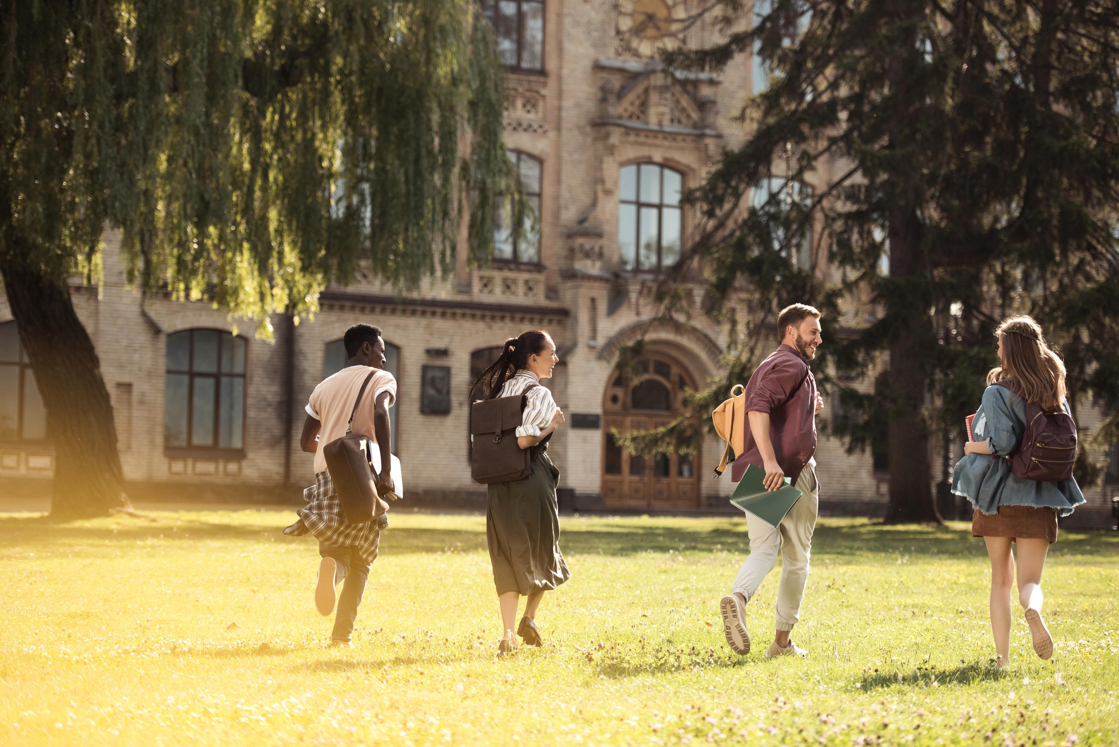 back-view-of-happy-multicultural-students-running-2023-11-27-05-21-45-utc (1).jpg